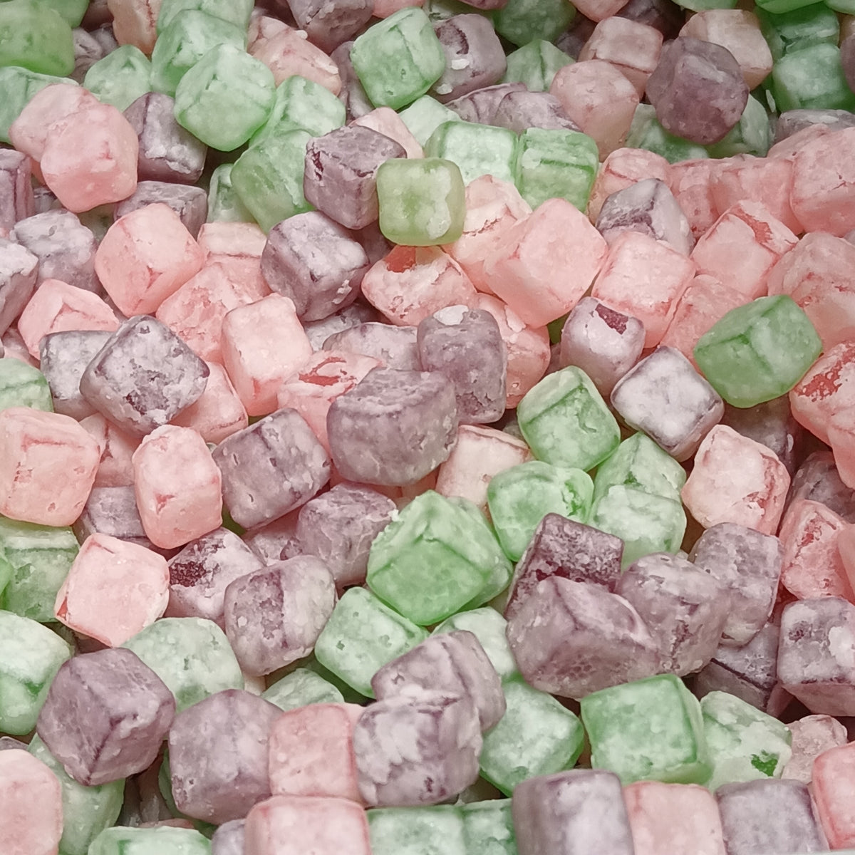 Fruit flavored gummy cubes in bright colors, similar to the chewy format most creatine gummy brands use