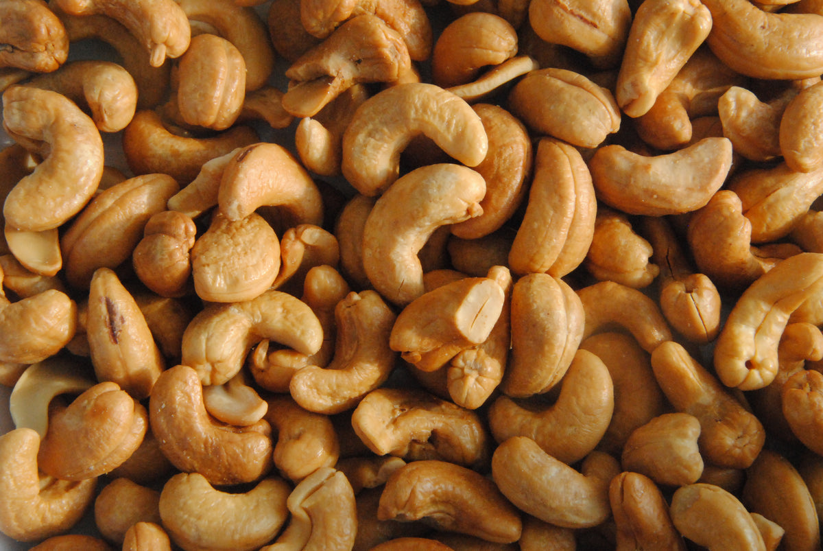 A close-up pile of roasted cashew nuts, a food source of magnesium
