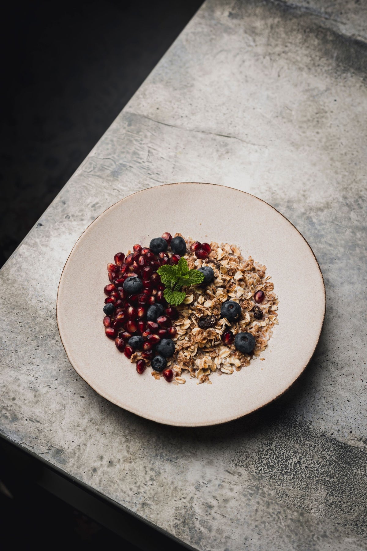 A bright bowl of berries, granola, and fresh fruit